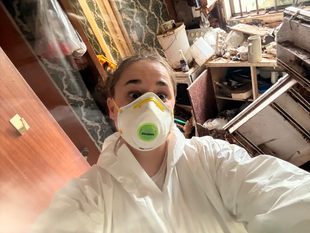 Terri wearing protective workwear during a cleaning project